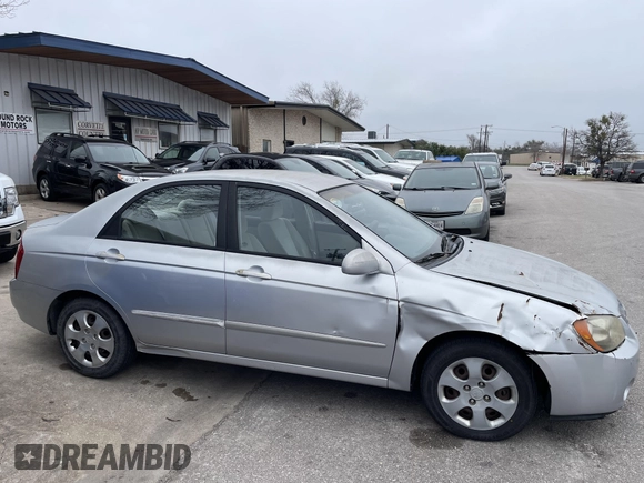 2004 Kia Spectra LX with VIN KNAFE121845043143, listed as a IAAI auction lot 41574523 with 211,758 mi miles. Bid and sale history available at carsss.com. Image 6.
