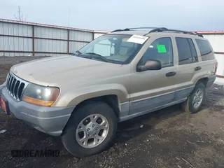 2000 Jeep Grand Cherokee Laredo with VIN 1J4GW48S4YC256978, listed as a IAAI auction lot 40652709 with 117,859 mi miles and . Bid and sale history available at DreamBid. Image 2.