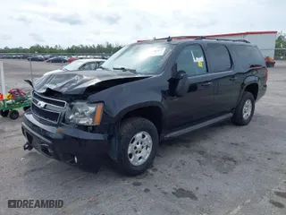2014 Chevrolet Suburban LT with VIN 1GNSKJE73ER130976, listed as a IAAI auction lot 42016692 with 73,263 mi miles. Bid and sale history available at carsss.com. Image 2.