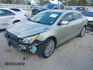 2014 Buick LaCrosse Premium II with VIN 1G4GF5G32EF129559, listed as a IAAI auction lot 41780260 with 120,487 mi miles and . Bid and sale history available at DreamBid. Image 2.