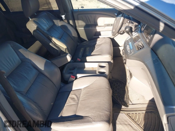 2010 Honda Odyssey EX-L with VIN 5FNRL3H77AB096732, listed as a IAAI auction lot 41831744 with 22,523 mi miles and . Bid and sale history available at DreamBid. Image 5.