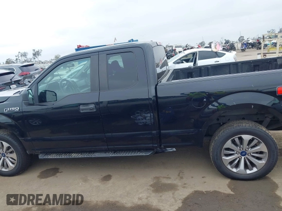 2018 Ford F-150 XL with VIN 1FTEX1EP6JKF59667, listed as a IAAI auction lot 42410311 with 134,385 mi miles and . Bid and sale history available at DreamBid. Image 14.
