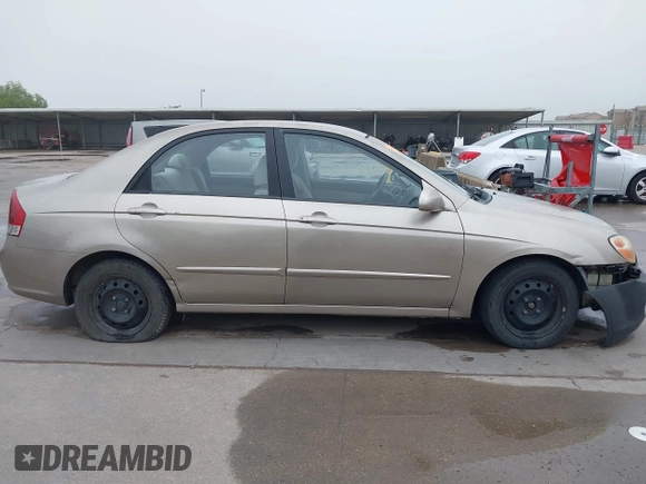 2007 Kia Spectra EX z VIN KNAFE121775404494, wystawiony jako IAAI lot #42140090 z przebiegiem 177 994 mil mil oraz . Historia ofert i sprzedaży dostępna na DreamBid. Obrazek 13.