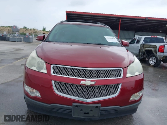2011 Chevrolet Traverse LTZ z VIN 1GNKRLED6BJ142238, wystawiony jako IAAI lot #42183153 z przebiegiem 149 483 mil mil oraz . Historia ofert i sprzedaży dostępna na DreamBid. Obrazek 12.