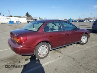2001 Saturn SL z VIN 1G8ZK54731Z305098, wystawiony jako Copart lot #83875424 z przebiegiem 82 879 mil mil oraz Tytuł czysty. Historia ofert i sprzedaży dostępna na DreamBid. Obrazek 3.