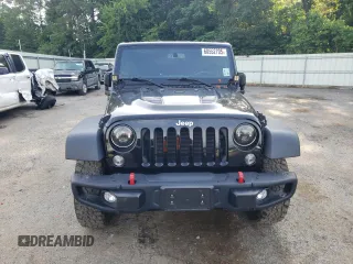 2016 Jeep Wrangler Unlimited Rubicon with VIN 1C4HJWFG9GL220687, listed as a Copart auction lot 60552705 with 49,525 mi miles and Salvage title. Bid and sale history available at DreamBid. Image 5.