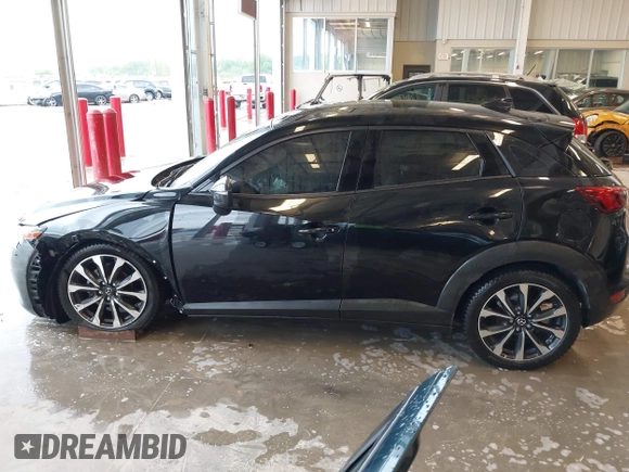 2019 Mazda CX-3 Touring z VIN JM1DKDC70K0404219, wystawiony jako IAAI lot #42148454 z przebiegiem 80 539 mil mil oraz . Historia ofert i sprzedaży dostępna na DreamBid. Obrazek 14.