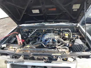 1999 Nissan Frontier XE z VIN 1N6ED26Y6XC301588, wystawiony jako IAAI lot #42703428 z przebiegiem Nie podano mil oraz . Historia ofert i sprzedaży dostępna na DreamBid. Obrazek 10.