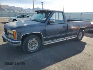 1990 GMC Sierra 1500 with VIN 1GTFC24K2LE554012, listed as a Copart auction lot 86004084 with 174,771 mi miles and Clean Title. Bid and sale history available at DreamBid. Image 1.