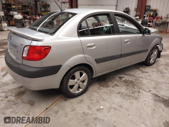 2009 Kia Rio LX with VIN KNADE223596444133, listed as a IAAI auction lot 41598865 with Not Provided miles and . Bid and sale history available at DreamBid. Image 4.