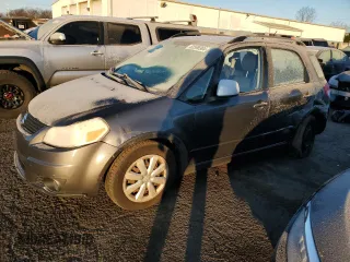 2010 Suzuki SX4 with VIN JS2YB5A31A6300055, listed as a Copart auction lot 82596904 with 80,715 mi miles and Salvage Title. Bid and sale history available at carsss.com. Image 1.