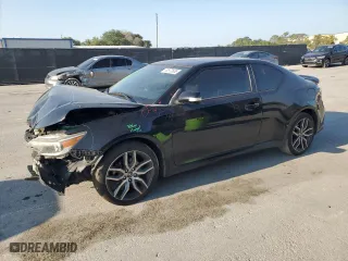 2015 Scion tC with VIN JTKJF5C79FJ003581, listed as a Copart auction lot 52973655 with 106,641 mi miles and Salvage Title. Bid and sale history available at carsss.com. Image 1.