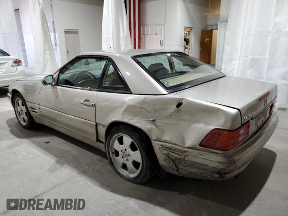 1999 Mercedes-Benz SL-Class with VIN WDBFA68F9XF172312, listed as a Copart auction lot 61248884 with 104,331 mi miles and Salvage Title. Bid and sale history available at carsss.com. Image 2.