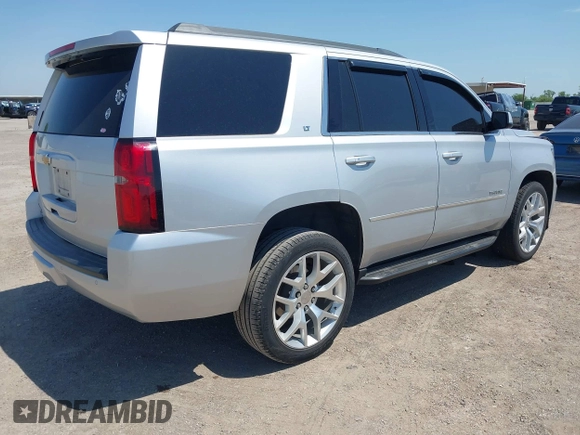 2015 Chevrolet Tahoe LT with VIN 1GNSCBKC6FR303850, listed as a IAAI auction lot 42254115 with 147,856 mi miles and . Bid and sale history available at DreamBid. Image 4.