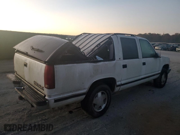 1996 Chevrolet Suburban z VIN 3GNFK16R7TG124404, wystawiony jako Copart lot #77361264 z przebiegiem 256 935 mil mil oraz Szkoda całkowita • Salvage title. Historia ofert i sprzedaży dostępna na DreamBid. Obrazek 3.