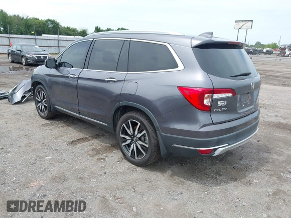 2019 Honda Pilot Touring 8-Passenger with VIN 5FNYF5H93KB028641, listed as a IAAI auction lot 42524078 with 56,744 mi miles and . Bid and sale history available at DreamBid. Image 3.