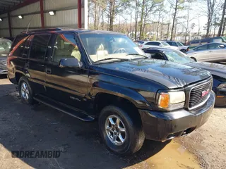 2000 GMC Denali with VIN 1GKEK13R1YR129862, listed as a IAAI auction lot 41833054 with 223,811 mi miles. Bid and sale history available at carsss.com. Image 1.