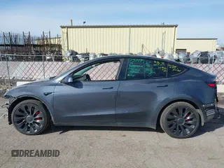 2023 Tesla Model Y Performance with VIN 7SAYGDEF7PF590750, listed as a IAAI auction lot 41694002 with Not Provided miles and . Bid and sale history available at DreamBid. Image 14.