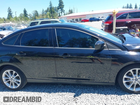 2018 Ford Focus SE z VIN 1FADP3FE5JL279274, wystawiony jako IAAI lot #42626587 z przebiegiem 92 110 mil mil oraz . Historia ofert i sprzedaży dostępna na DreamBid. Obrazek 14.