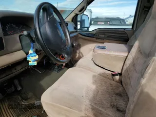 1999 Ford Super Duty F-250 XL with VIN 1FTNW21F6XEC59527, listed as a Copart auction lot 84740234 with 265,651 mi miles and Salvage Title. Bid and sale history available at carsss.com. Image 7.