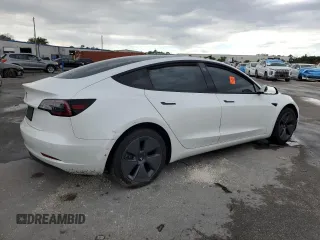 2021 Tesla Model 3 Standard Range Plus z VIN 5YJ3E1EA2MF859832, wystawiony jako Copart lot #56743865 z przebiegiem 77 025 mil mil oraz Nie do naprawy. Historia ofert i sprzedaży dostępna na DreamBid. Obrazek 3.