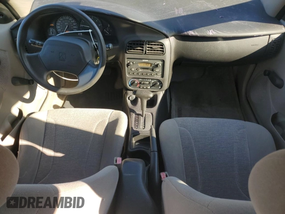 2001 Saturn SL z VIN 1G8ZK54731Z305098, wystawiony jako Copart lot #83875424 z przebiegiem 82 879 mil mil oraz Tytuł czysty. Historia ofert i sprzedaży dostępna na DreamBid. Obrazek 8.