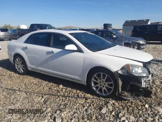 2012 Chevrolet Malibu LTZ with VIN 1G1ZG5E7XCF122655, listed as a Copart auction lot 54619015 with 164,118 mi miles and Salvage Title. Bid and sale history available at DreamBid. Image 4.
