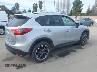 2016 Mazda CX-5 Grand Touring with VIN JM3KE2DY9G0723921, listed as a IAAI auction lot 41681522 with 83,893 mi miles. Bid and sale history available at carsss.com. Image 4.