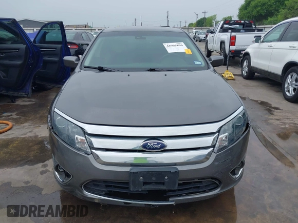 2012 Ford Fusion Hybrid z VIN 3FADP0L33CR289548, wystawiony jako IAAI lot #41905806 z przebiegiem 121 233 mil mil oraz . Historia ofert i sprzedaży dostępna na DreamBid. Obrazek 13.