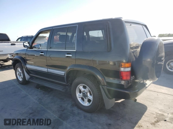 1999 Isuzu Trooper S with VIN JACDJ58X5X7912250, listed as a Copart auction lot 58521665 with 177,038 mi miles and Clean title. Bid and sale history available at DreamBid. Image 2.