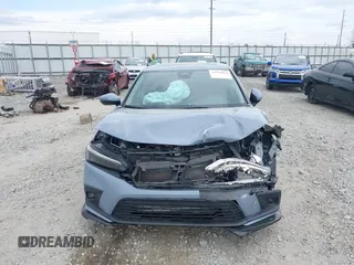 2023 Honda Civic Touring z VIN 2HGFE1F95PH325015, wystawiony jako IAAI lot #41796024 z przebiegiem 39 333 mil mil oraz . Historia ofert i sprzedaży dostępna na DreamBid. Obrazek 13.
