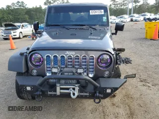 2017 Jeep Wrangler Unlimited Sport with VIN 1C4BJWDG8HL680627, listed as a Copart auction lot 61241735 with 100,890 mi miles and Salvage title. Bid and sale history available at DreamBid. Image 5.