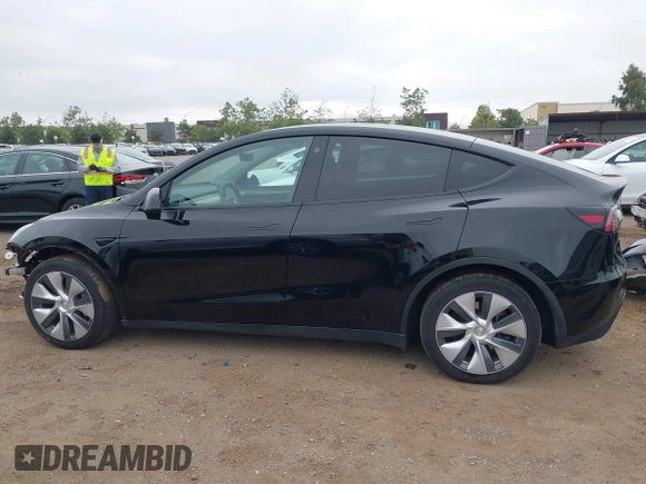 2023 Tesla Model Y Long Range with VIN 7SAYGDEEXPA044335, listed as a IAAI auction lot 42350159 with 26,731 mi miles and . Bid and sale history available at DreamBid. Image 15.