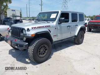 2023 Jeep Wrangler Rubicon with VIN 1C4JJXFG0PW522651, listed as a IAAI auction lot 42112210 with 7,744 mi miles and . Bid and sale history available at DreamBid. Image 18.
