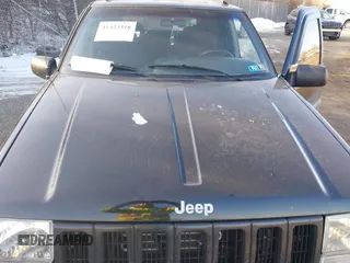 1996 Jeep Grand Cherokee Laredo with VIN 1J4GZ58S3TC197587, listed as a IAAI auction lot 41423318 with 200,116 mi miles. Bid and sale history available at carsss.com. Image 10.