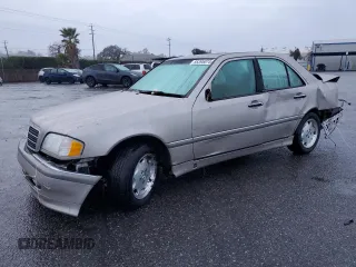 1999 Mercedes-Benz C 230/260/280/320 with VIN WDBHA29G9XA747479, listed as a Copart auction lot 85395074 with 98,299 mi miles and Salvage Title. Bid and sale history available at carsss.com. Image 1.