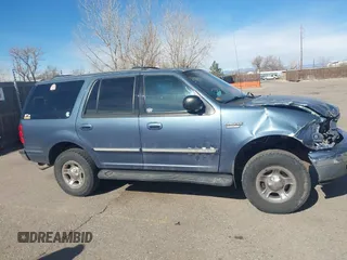 1999 Ford Expedition XLT z VIN 1FMPU18L2XLB43236, wystawiony jako IAAI lot #41792317 z przebiegiem 157 636 mil mil oraz . Historia ofert i sprzedaży dostępna na DreamBid. Obrazek 14.