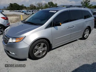 2012 Honda Odyssey Touring z VIN 5FNRL5H98CB108709, wystawiony jako Copart lot #56257285 z przebiegiem 169 335 mil mil oraz Szkoda całkowita • Salvage title. Historia ofert i sprzedaży dostępna na DreamBid. Obrazek 1.