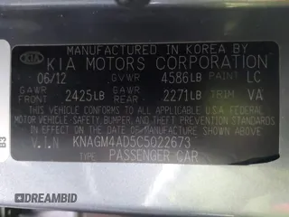 2012 Kia Optima Hybrid with VIN KNAGM4AD5C5022673, listed as a IAAI auction lot 41506860 with 121,982 mi miles. Bid and sale history available at carsss.com. Image 9.
