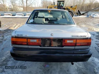 1990 Toyota Camry z VIN 4T1VV21EXLU008760, wystawiony jako Copart lot #88344665 z przebiegiem 154 971 mil mil oraz Nie do naprawy • Non repairable. Historia ofert i sprzedaży dostępna na DreamBid. Obrazek 6.