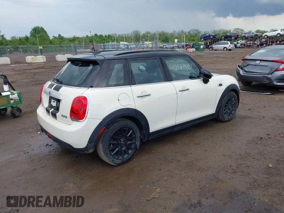 2015 MINI Hardtop 4 Door with VIN WMWXS5C52FT831291, listed as a IAAI auction lot 42179801 with 63,261 mi miles and . Bid and sale history available at DreamBid. Image 4.