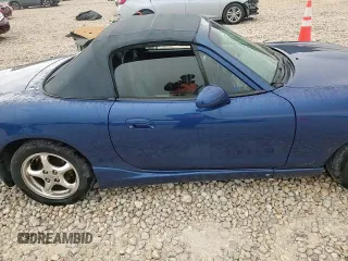 1999 Mazda MX-5 Miata with VIN JM1NB3532X0134801, listed as a Copart auction lot 83838374 with 97,015 mi miles and Salvage title. Bid and sale history available at DreamBid. Image 11.
