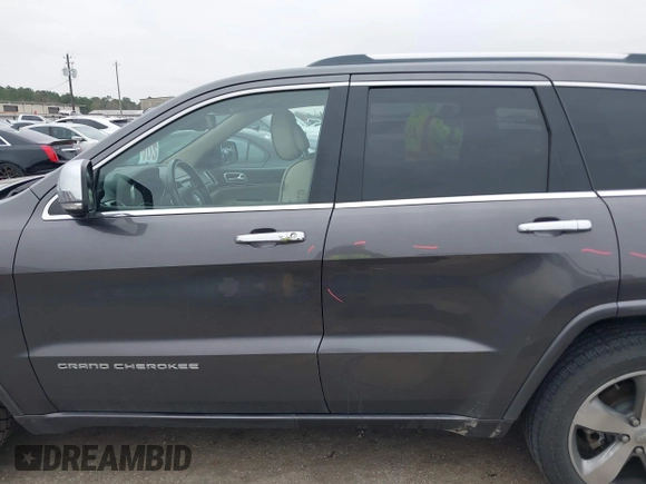 2014 Jeep Grand Cherokee Overland with VIN 1C4RJECG5EC207211, listed as a IAAI auction lot 41586309 with 115,293 mi miles. Bid and sale history available at carsss.com. Image 15.