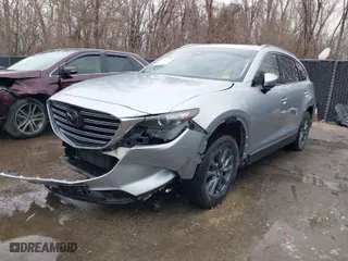 2021 Mazda CX-9 Touring with VIN JM3TCBCY2M0507027, listed as a IAAI auction lot 41079723 with 61,387 mi miles. Bid and sale history available at carsss.com. Image 2.