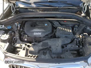 2018 BMW X1 xDrive28i z VIN WBXHT3C3XJ5K32176, wystawiony jako Copart lot #88102885 z przebiegiem 130 394 mil mil oraz Szkoda całkowita • Salvage title. Historia ofert i sprzedaży dostępna na DreamBid. Obrazek 12.