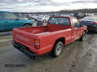 1991 Mitsubishi Mighty Max z VIN JA7FL24W3MP017705, wystawiony jako Copart lot #85737304 z przebiegiem 261 896 mil mil oraz Szkody całkowita. Historia ofert i sprzedaży dostępna na DreamBid. Obrazek 3.