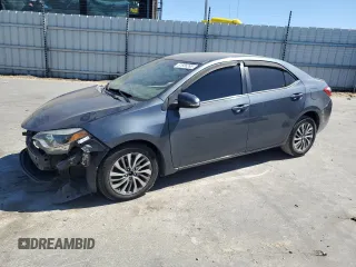 2014 Toyota Corolla L with VIN 5YFBURHE9EP102184, listed as a Copart auction lot 61586265 with 218,755 mi miles and Salvage title. Bid and sale history available at DreamBid. Image 1.