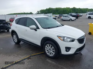 2014 Mazda CX-5 Touring z VIN JM3KE4CY0E0321845, wystawiony jako IAAI lot #42165783 z przebiegiem 154 225 mil mil oraz . Historia ofert i sprzedaży dostępna na DreamBid. Obrazek 1.