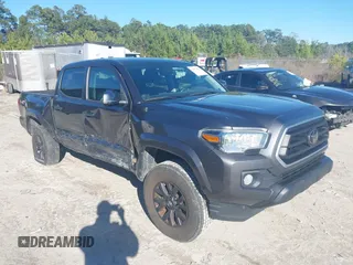 2022 Toyota Tacoma SR5 with VIN 3TMAZ5CN9NM180470, listed as a IAAI auction lot 41571951 with 102,220 mi miles and . Bid and sale history available at DreamBid. Image 1.