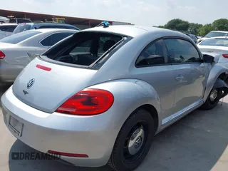 2013 Volkswagen Beetle 2.5L with VIN 3VWJX7AT7DM673319, listed as a IAAI auction lot 42169554 with 128,622 mi miles and . Bid and sale history available at DreamBid. Image 4.